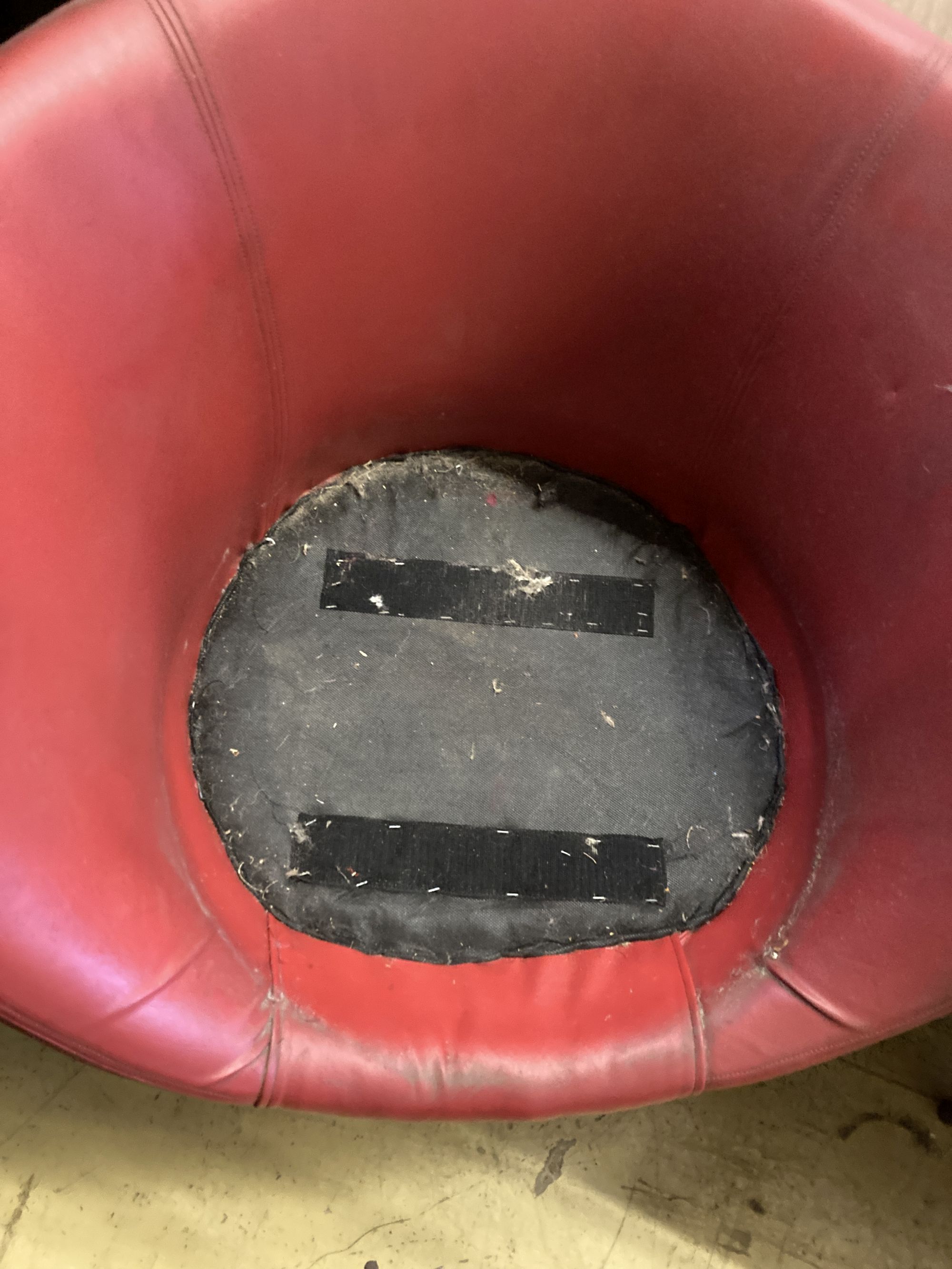 A 1970s red leatherette tub framed swivel chair, width 74cm, depth 64cm, height 74cm